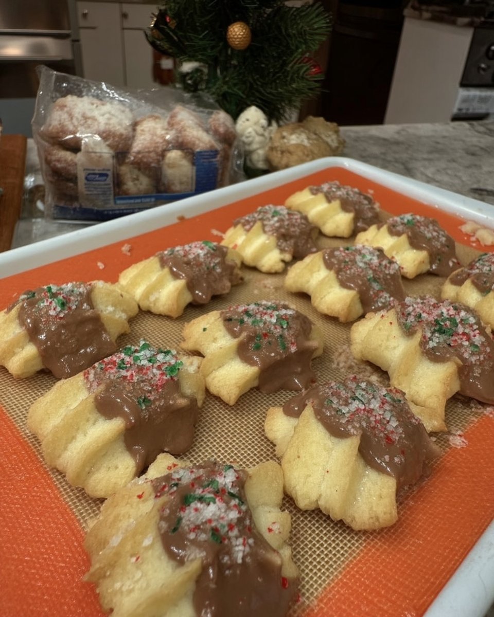 Baked butter spritz cookies served with a cup of tea
