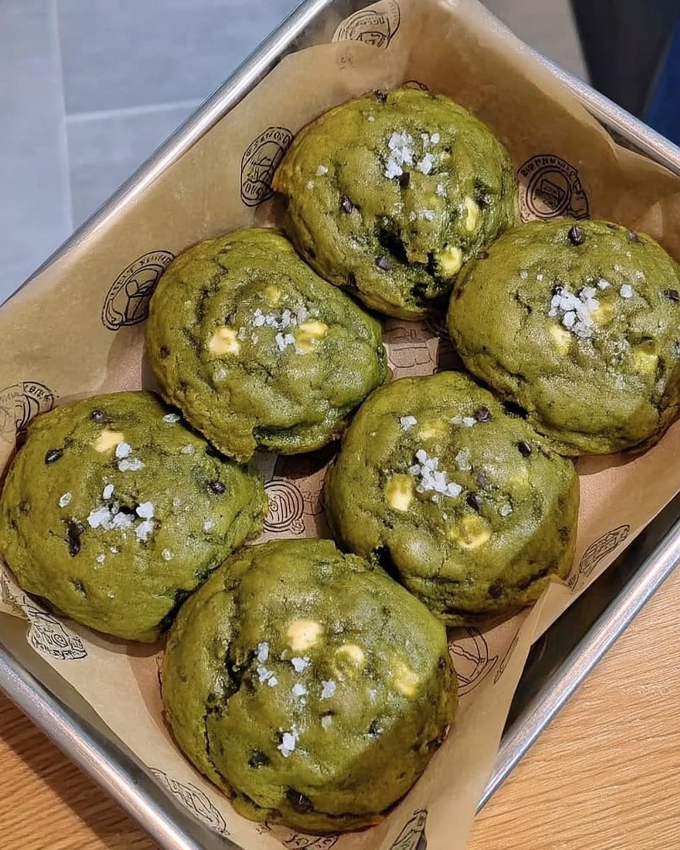 Matcha cookies served next to a steaming cup of tea