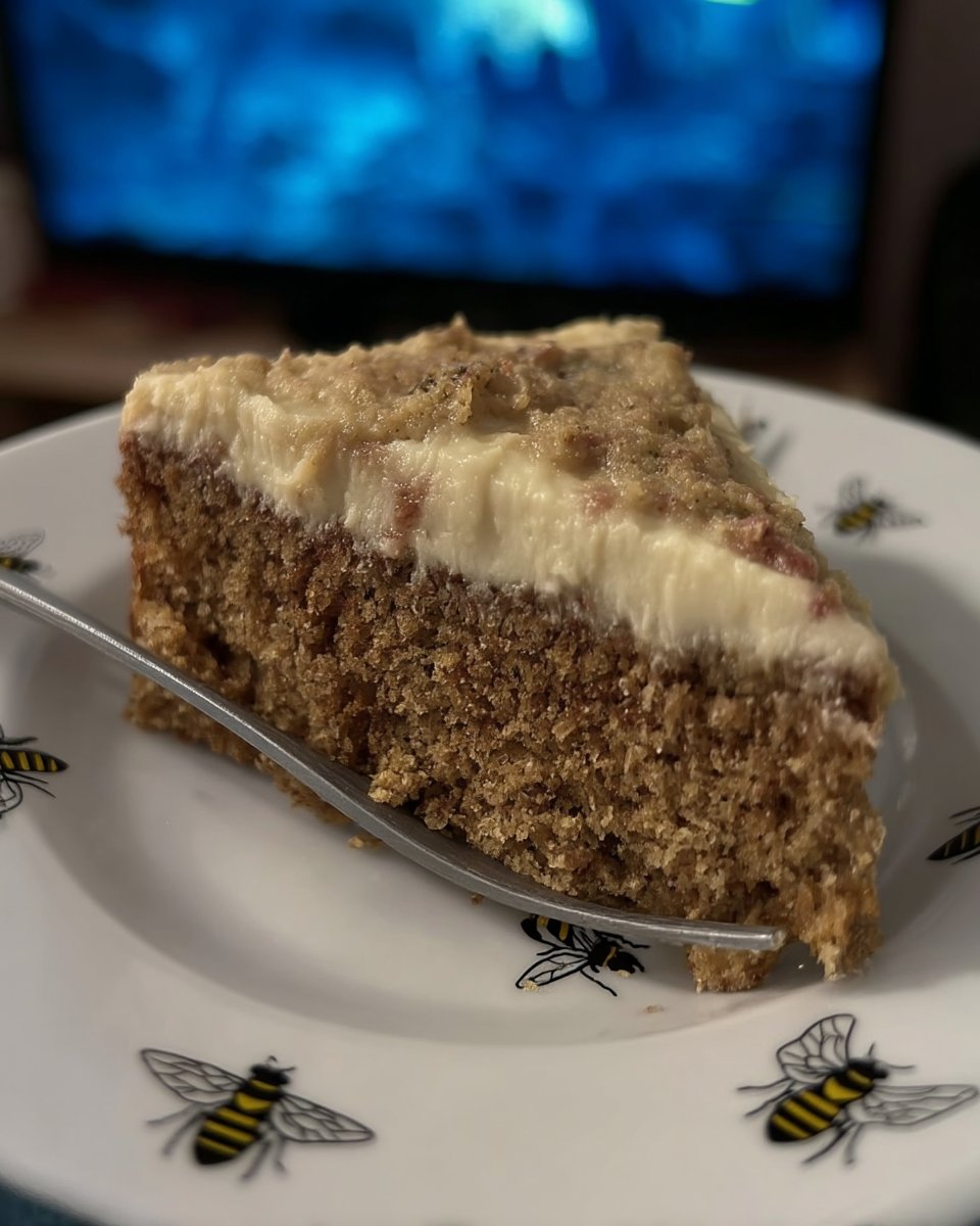 Fluffy spiced cream cheese frosting in a mixing bowl