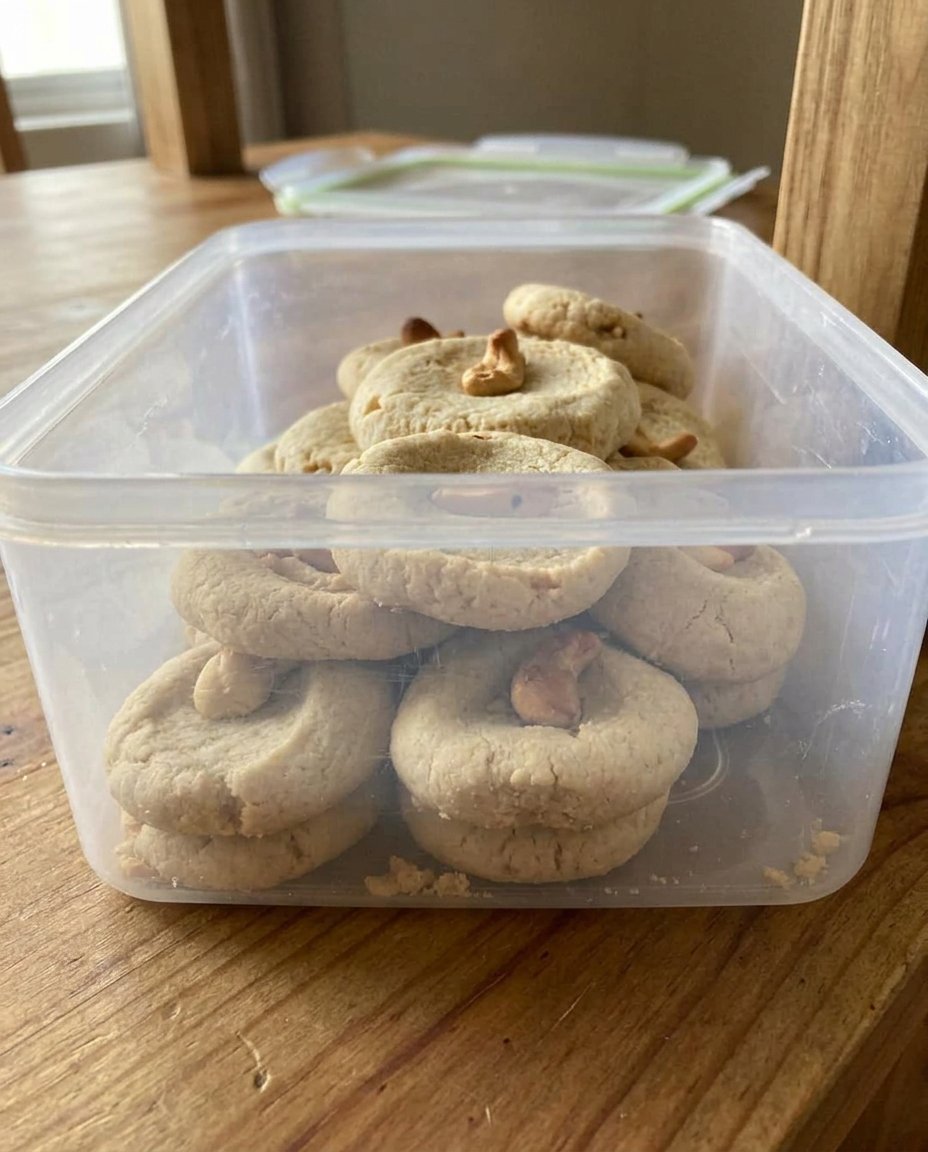 Golden cashew shortbread cookies on a wire rack