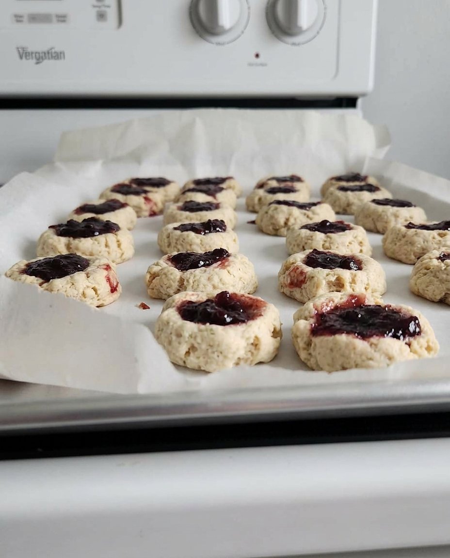 Peach thumbprint cookies served with a cup of aromatic tea