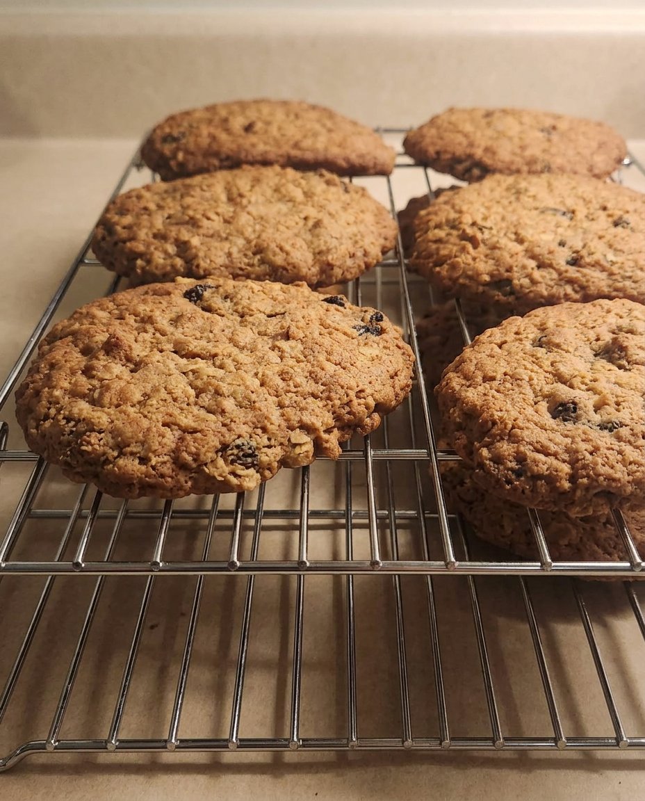 A plate of rum raisin cookies served with a cup of hot chai tea
