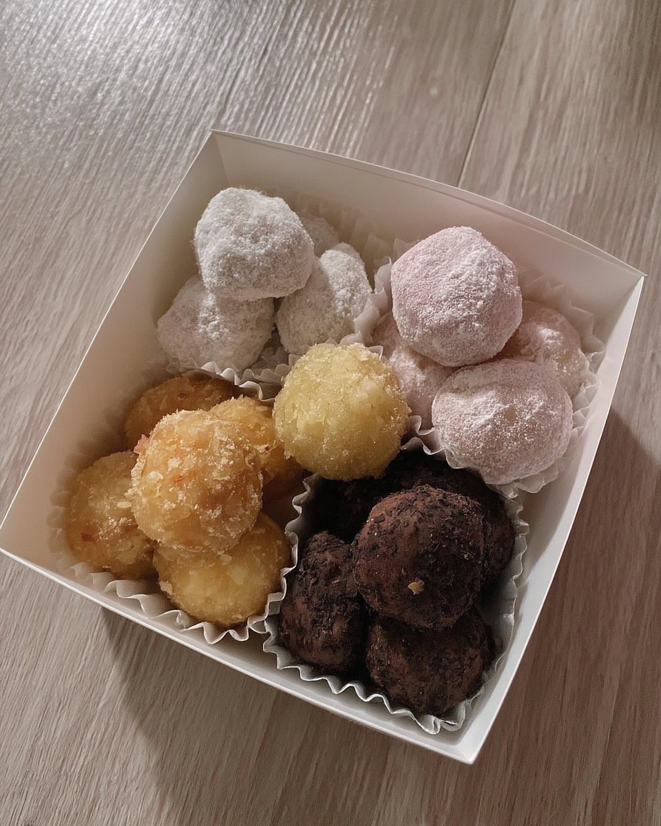 Snowball cookies served on a plate with a cup of coffee
