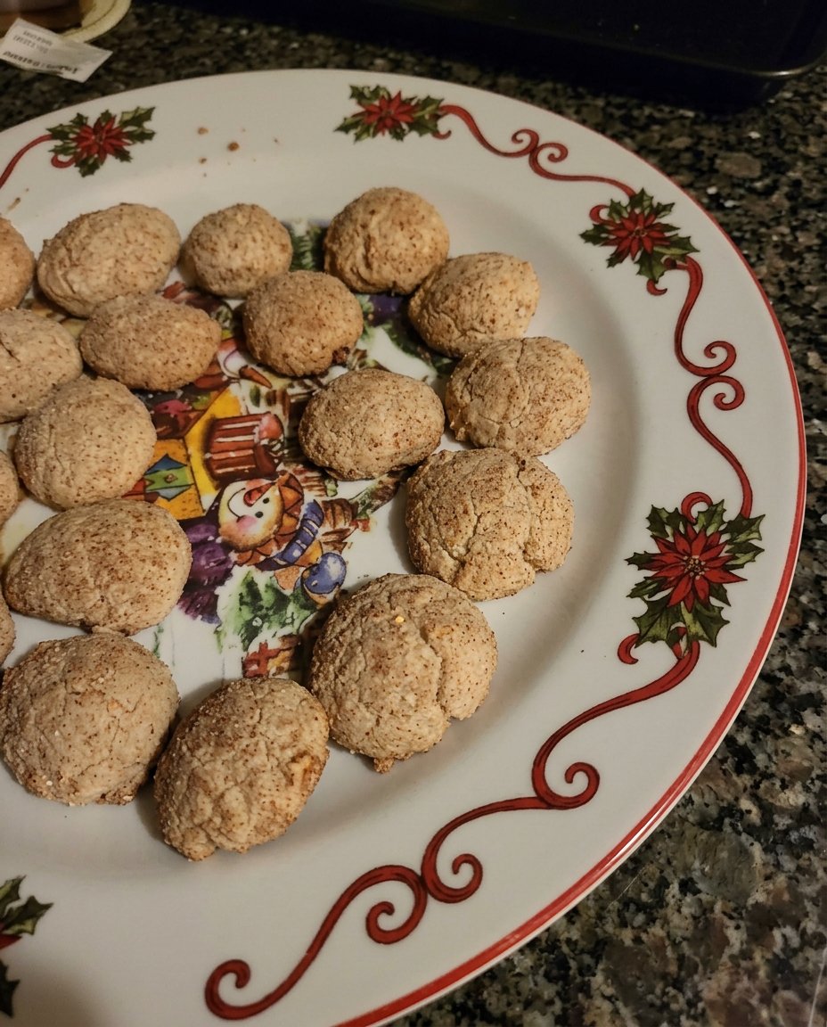 A close-up of a broken brown sugar cookie revealing its soft, thick center.