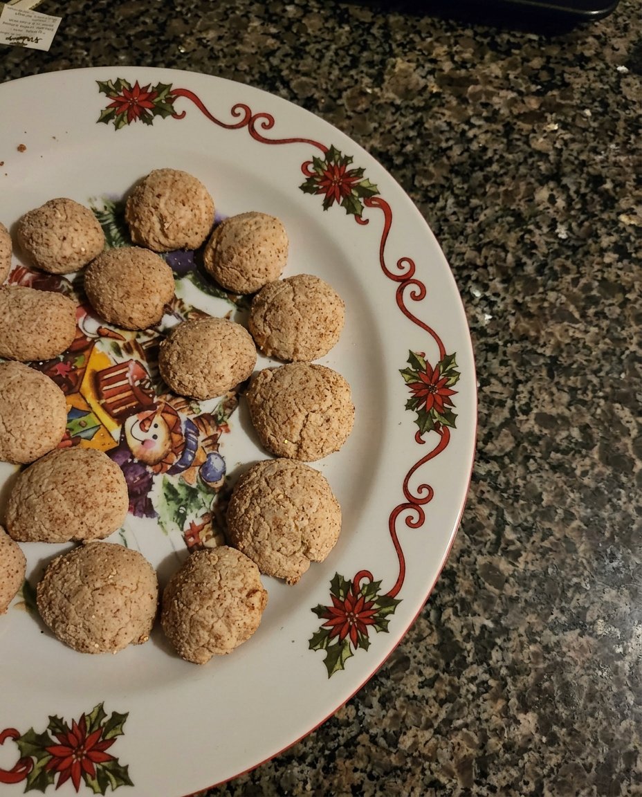 Chewy brown sugar cookies stacked on a wire cooling rack.
