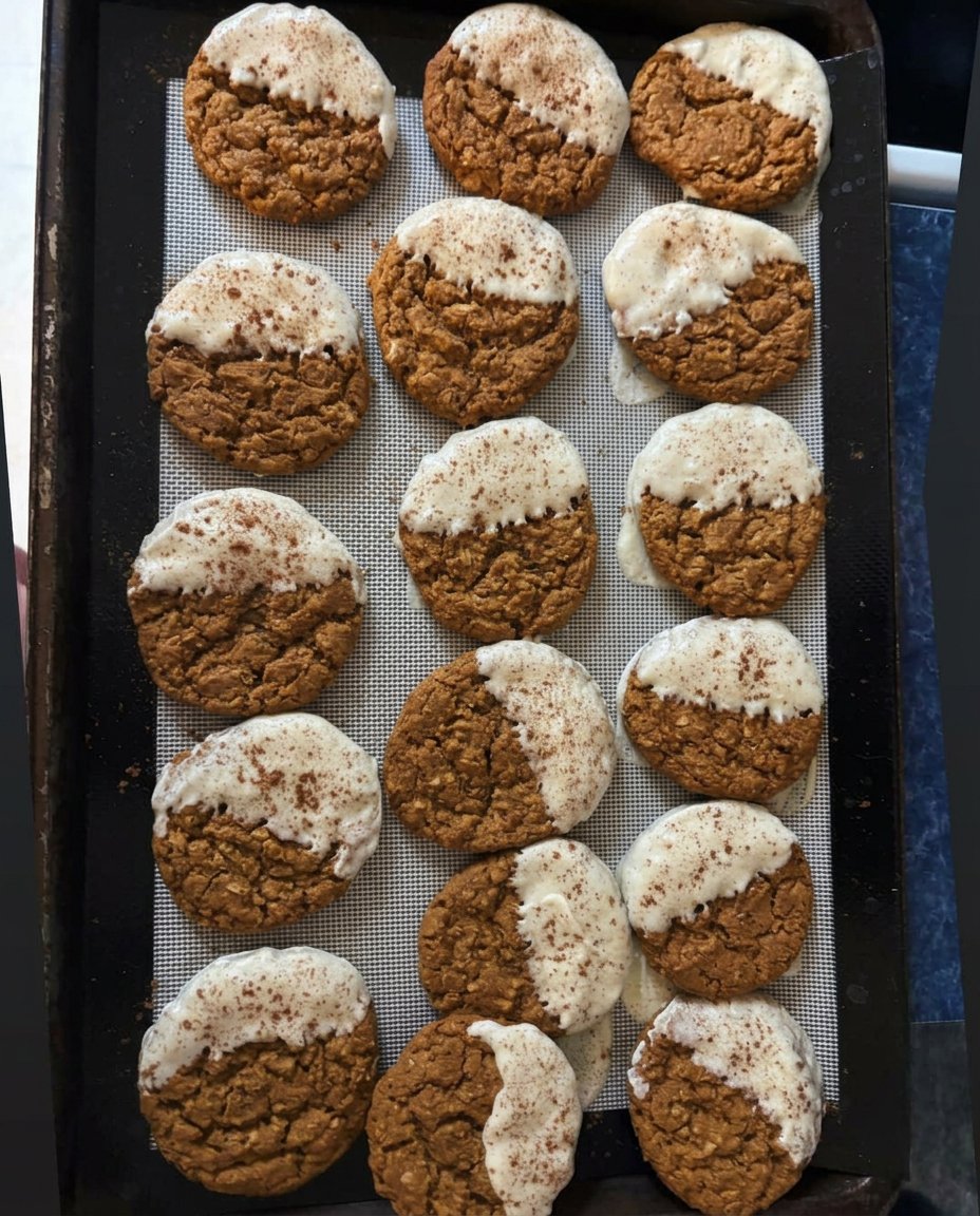 A plate of soft and crackled paleo gingerbread cookies on a wooden table.