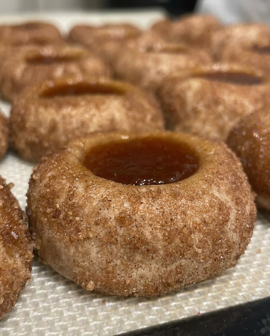 Finished peach pie thumbprint cookies with cinnamon glaze drizzle.