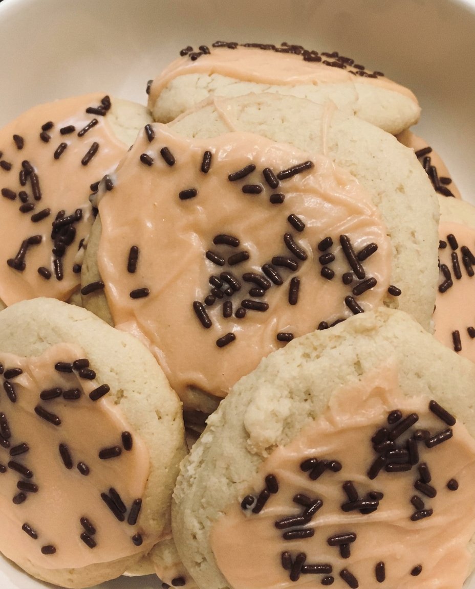 Vegan sugar cookies served with a cup of hot tea
